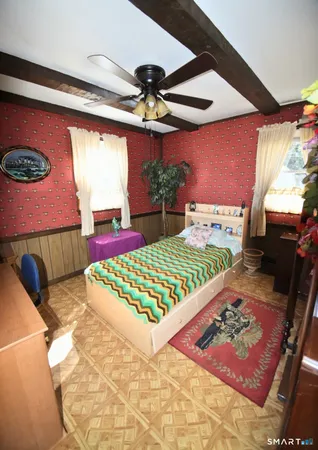 a bed room with a bed and a window