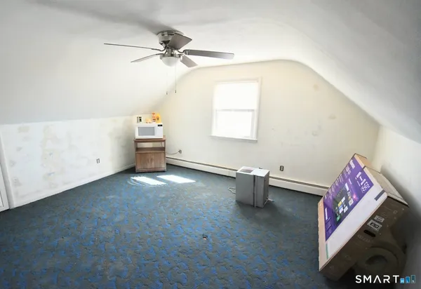 a view of a room with toys and wooden floor