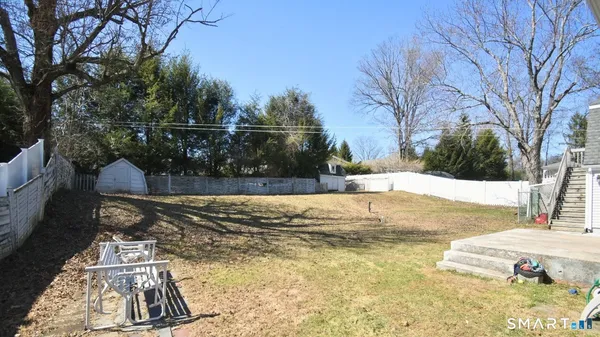 a view of a yard with trees