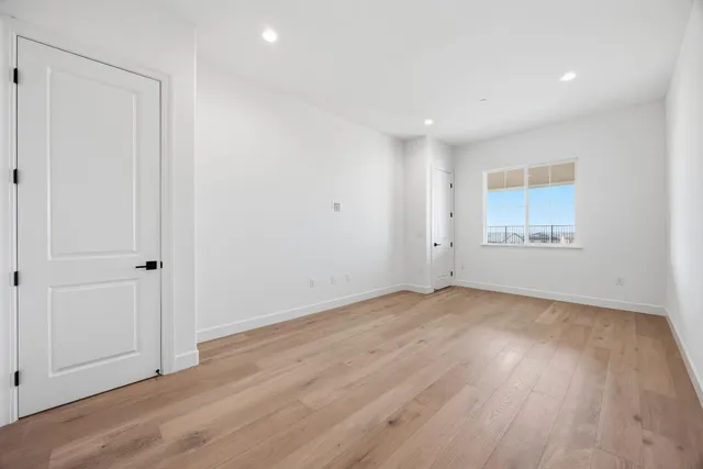 a bathroom with a sink mirror and toilet
