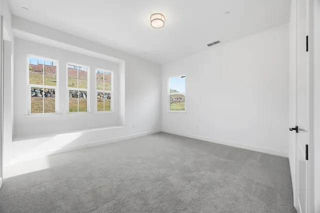 a view of a room with white walls