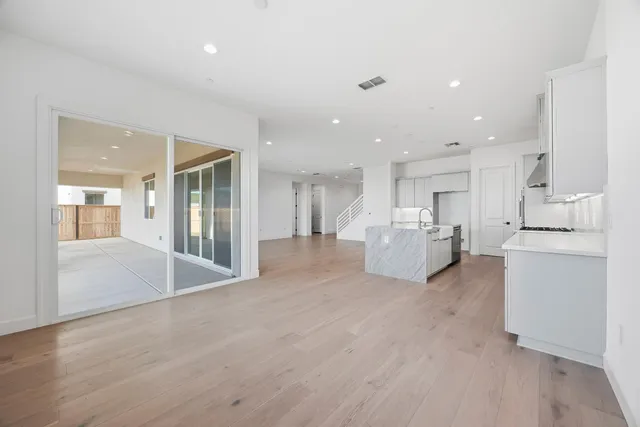 a view of a kitchen with a sink