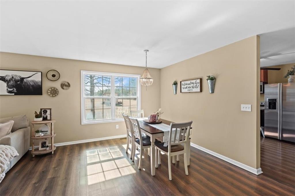 100 South Avery Road Southwest Rome, GA 30165 - Photo 17 of 50 a view of a dining room with furniture and wooden floor