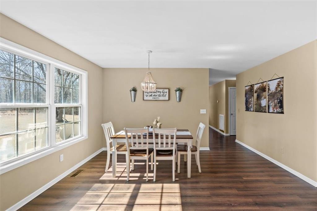 100 South Avery Road Southwest Rome, GA 30165 - Photo 18 of 50 a view of a dining room with furniture window and wooden floor