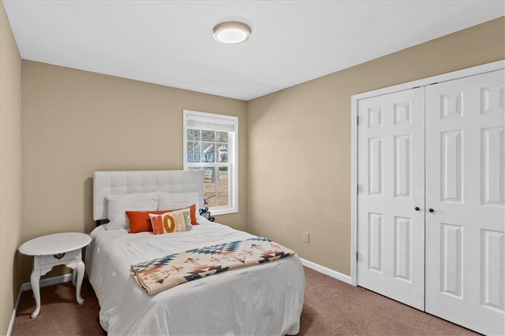100 South Avery Road Southwest Rome, GA 30165 - Photo 24 of 50 a bedroom with a bed and a window