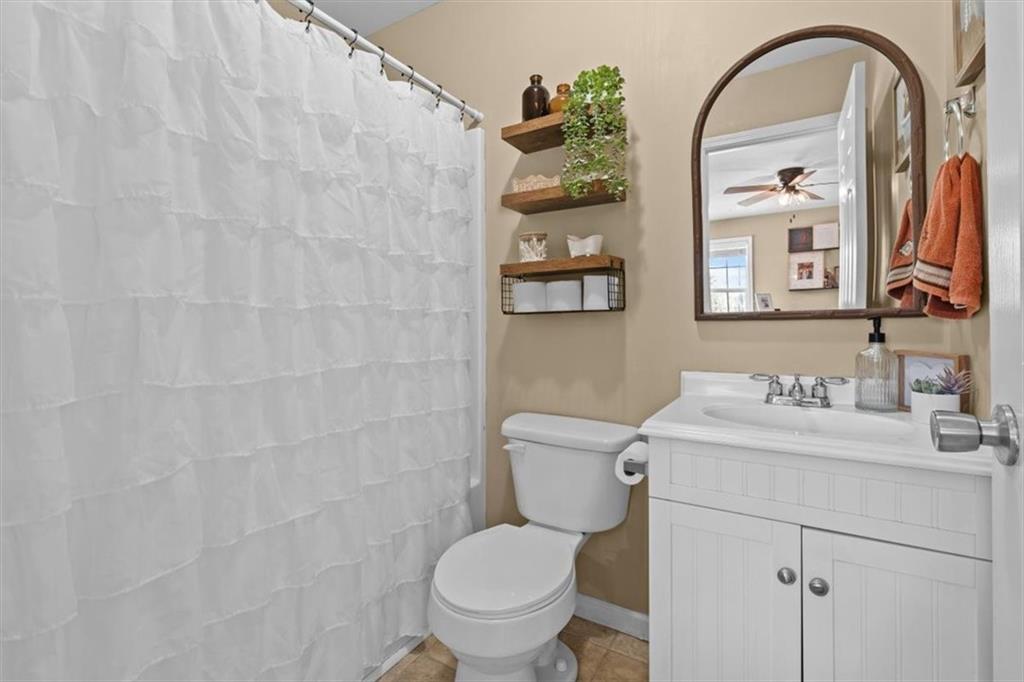 100 South Avery Road Southwest Rome, GA 30165 - Photo 25 of 50 a bathroom with a toilet sink and mirror