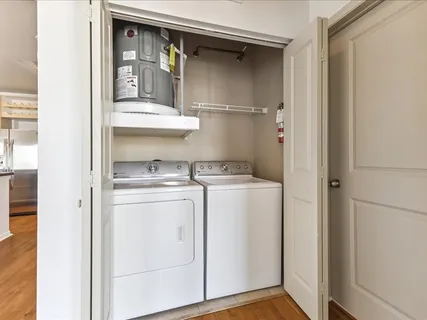 a view of hallway with wooden floor