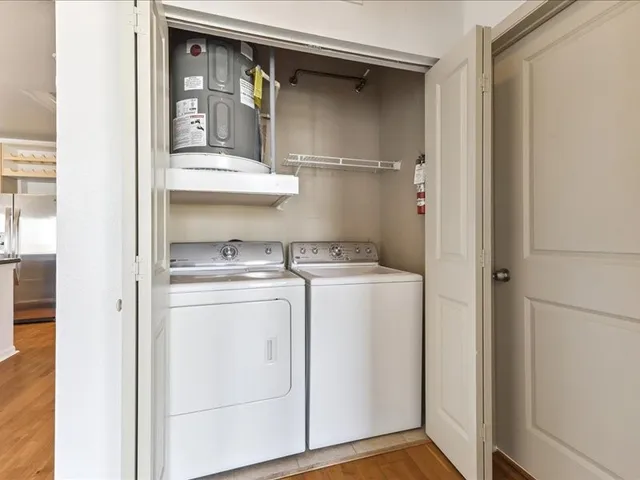a view of hallway with wooden floor
