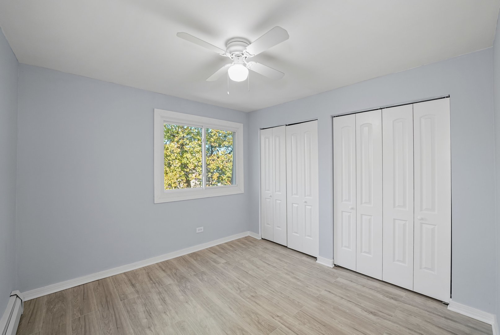 4819 West Engle Road, Unit 3D Alsip, IL 60803 - Photo 12 of 19 wooden floor in an empty room with a window