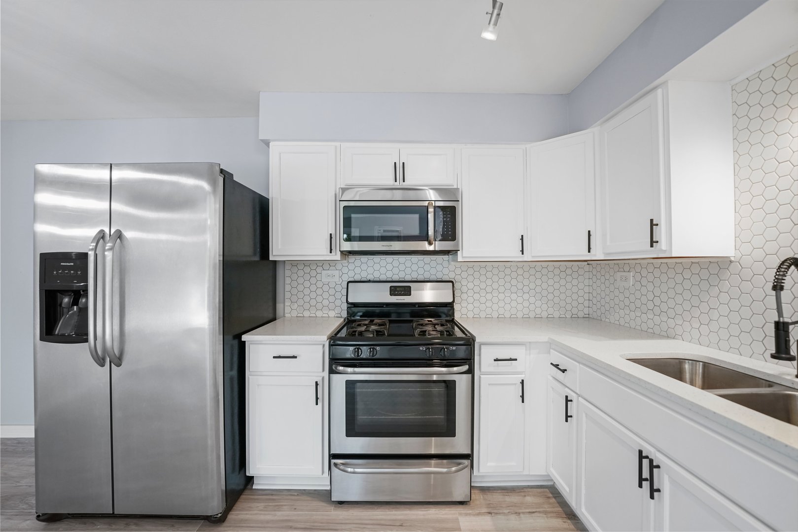 4819 West Engle Road, Unit 3D Alsip, IL 60803 - Photo 3 of 19 a kitchen with cabinets stainless steel appliances and a counter space