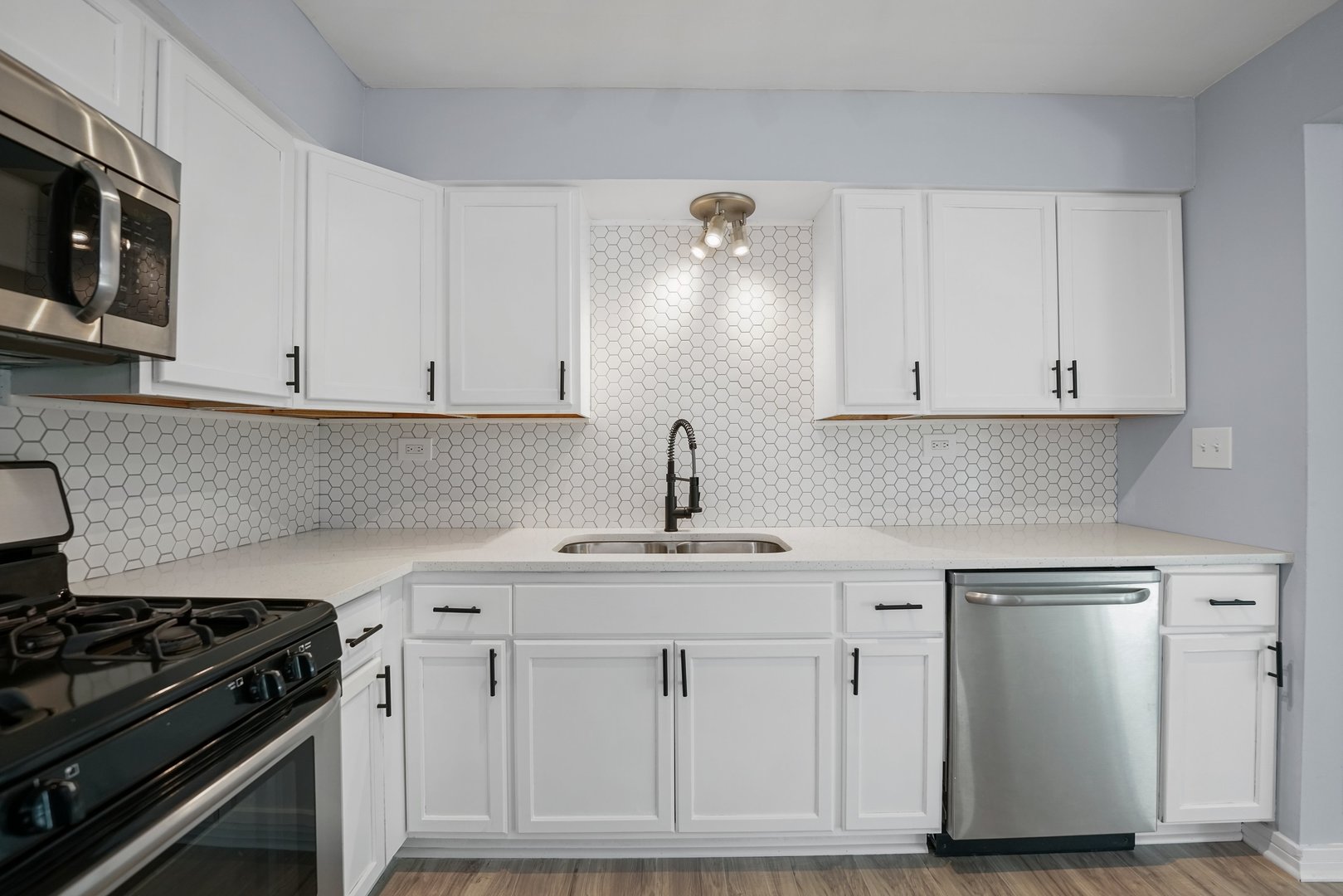 4819 West Engle Road, Unit 3D Alsip, IL 60803 - Photo 4 of 19 a kitchen with white cabinets and appliances