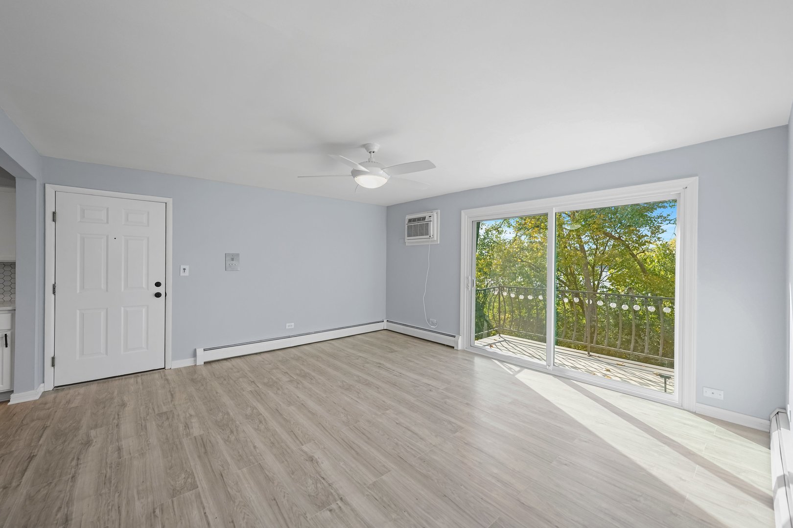 4819 West Engle Road, Unit 3D Alsip, IL 60803 - Photo 9 of 19 a view of an empty room with wooden floor and a window