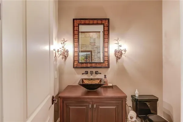 a view of a hallway with windows and chandelier