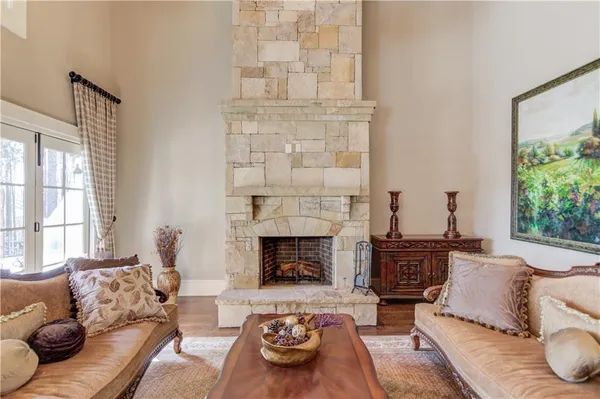 a bedroom with a bed and a fireplace