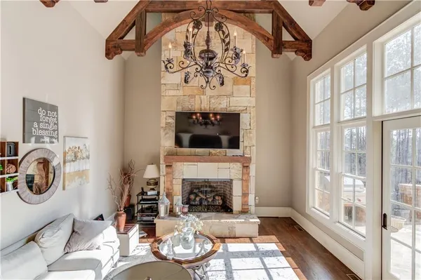 a bathroom with a granite countertop sink a toilet and a mirror