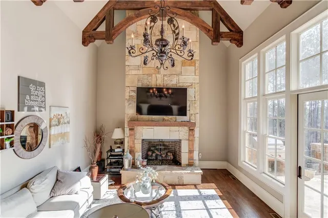 a bathroom with a granite countertop sink a toilet and a mirror