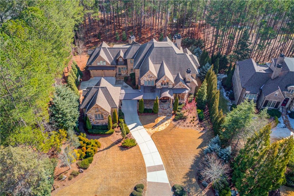 922 Little Darby Lane Suwanee, GA 30024 - Photo 2 of 109 an aerial view of a house with a yard and trees