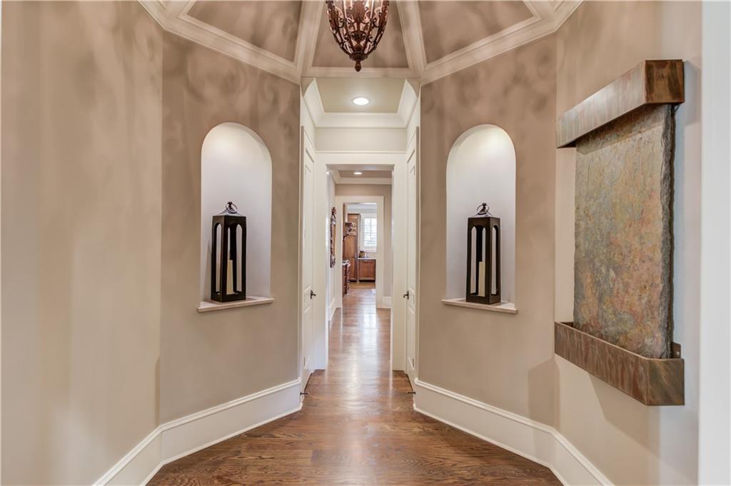 922 Little Darby Lane Suwanee, GA 30024 - Photo 29 of 109 a view of a hallway with windows and chandelier