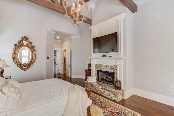 a kitchen with granite countertop a sink a washer and dryer next to a window