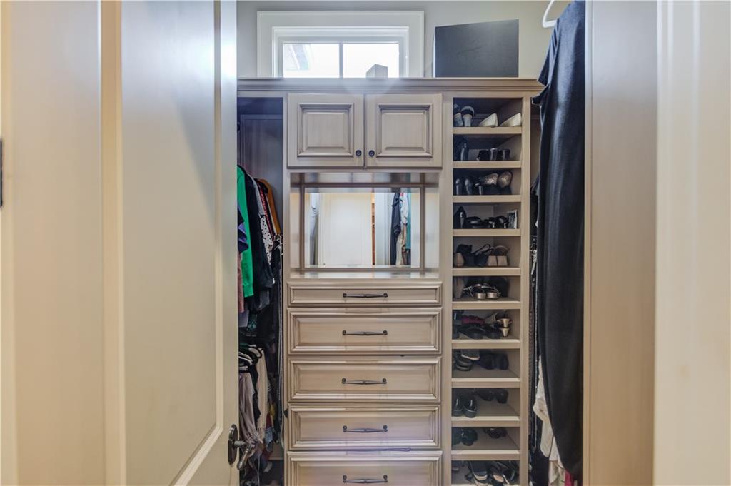 922 Little Darby Lane Suwanee, GA 30024 - Photo 39 of 109 a view of walk in closet with empty racks