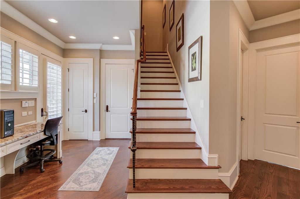 922 Little Darby Lane Suwanee, GA 30024 - Photo 41 of 109 a view of entryway with wooden floor and stairs
