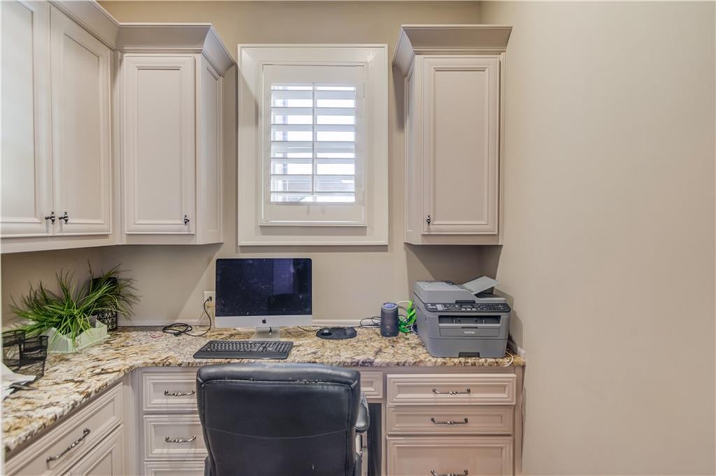 922 Little Darby Lane Suwanee, GA 30024 - Photo 44 of 109 a kitchen with cabinets appliances a sink and a window