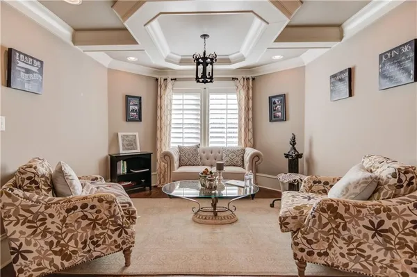a view of a backyard with plants and wooden fence