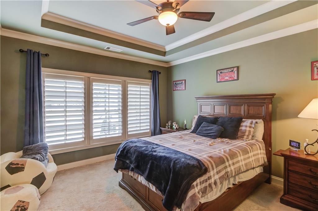 922 Little Darby Lane Suwanee, GA 30024 - Photo 54 of 109 a bedroom with a bed and a window