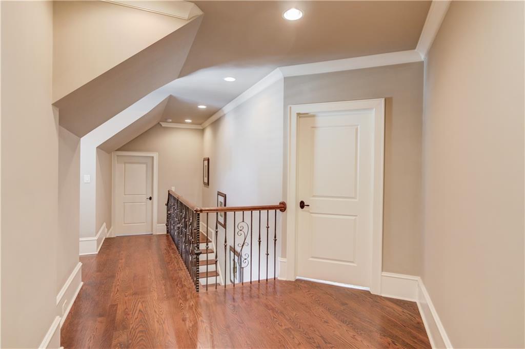 922 Little Darby Lane Suwanee, GA 30024 - Photo 60 of 109 a view of hallway with wooden floor