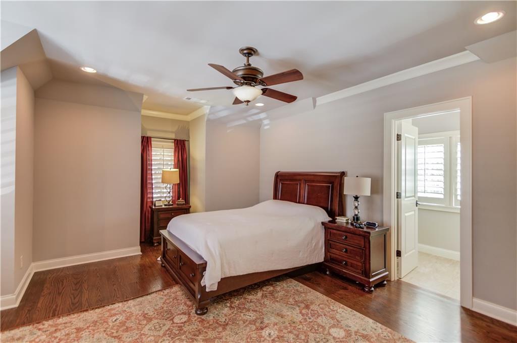 922 Little Darby Lane Suwanee, GA 30024 - Photo 62 of 109 a bedroom with a bed and a window