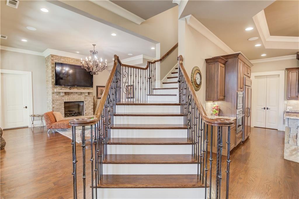 922 Little Darby Lane Suwanee, GA 30024 - Photo 66 of 109 a view of entryway livingroom and hall with wooden floor