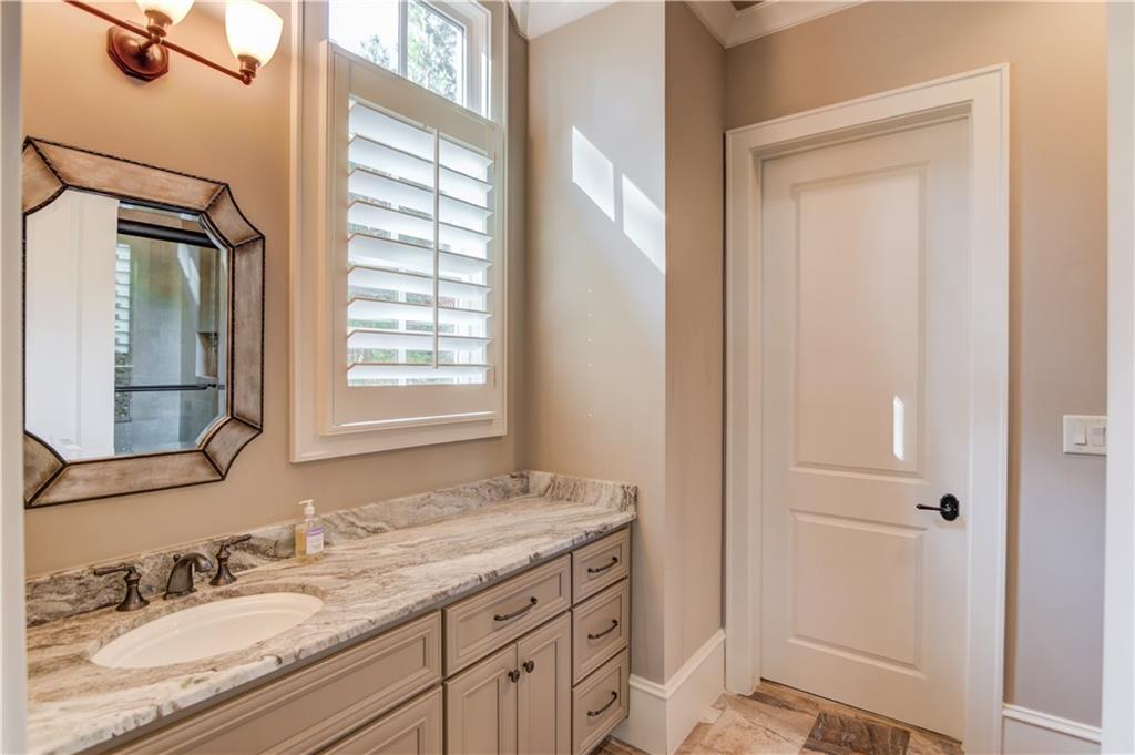 922 Little Darby Lane Suwanee, GA 30024 - Photo 84 of 109 a bathroom with a granite countertop sink toilet and shower
