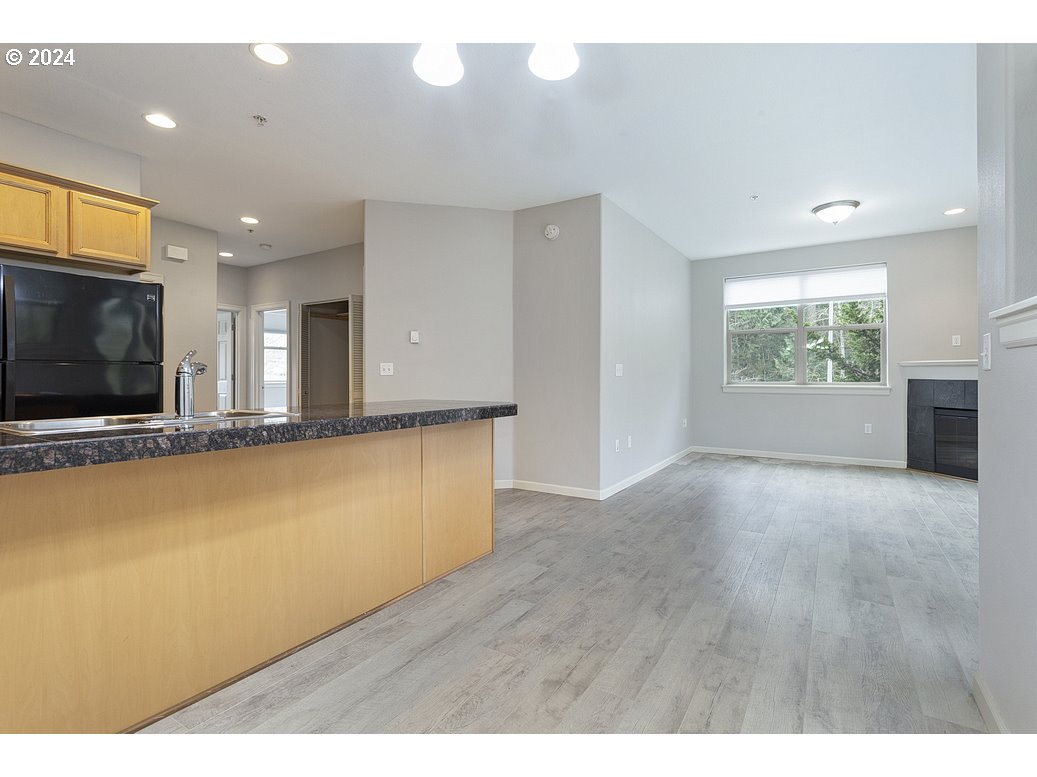 17301 Ruben Lane, Unit 10 Sandy, OR 97055 - Photo 13 of 33 a view of a livingroom with furniture wooden floor and window
