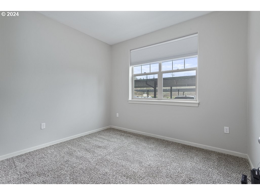 17301 Ruben Lane, Unit 10 Sandy, OR 97055 - Photo 23 of 33 an empty room with windows