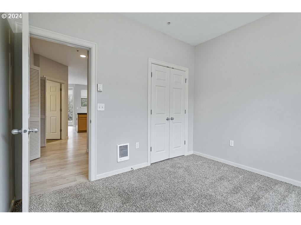17301 Ruben Lane, Unit 10 Sandy, OR 97055 - Photo 25 of 33 a view of an empty room and wooden floor