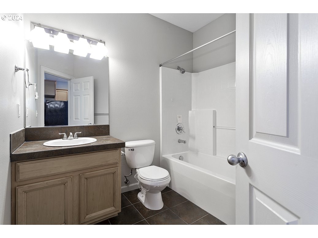 17301 Ruben Lane, Unit 10 Sandy, OR 97055 - Photo 27 of 33 a bathroom with a sink toilet tub and shower
