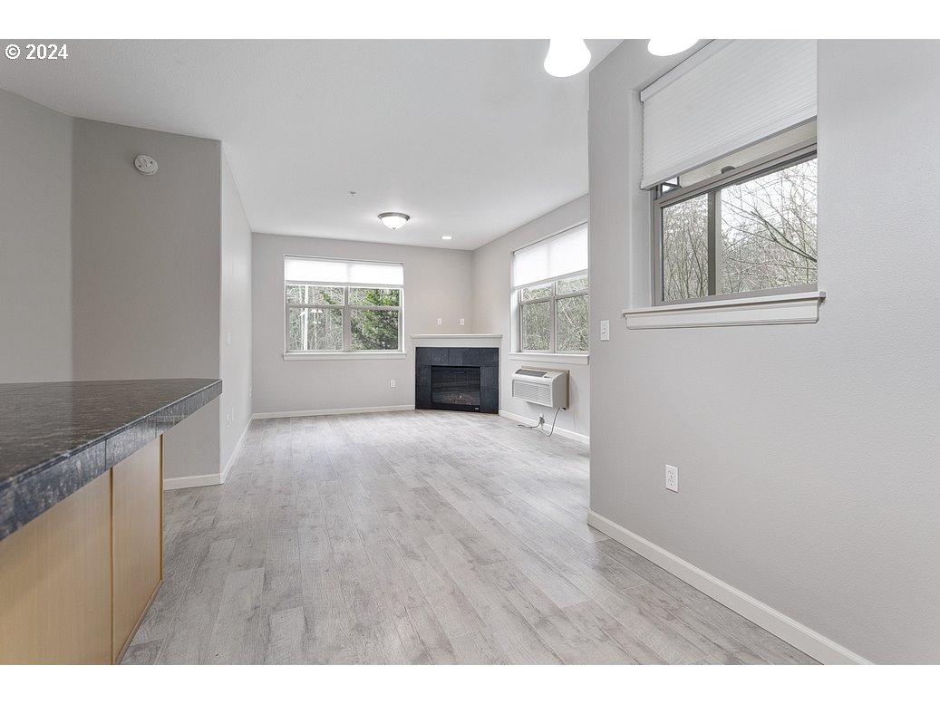 17301 Ruben Lane, Unit 10 Sandy, OR 97055 - Photo 9 of 33 a view of empty room with wooden floor and fan