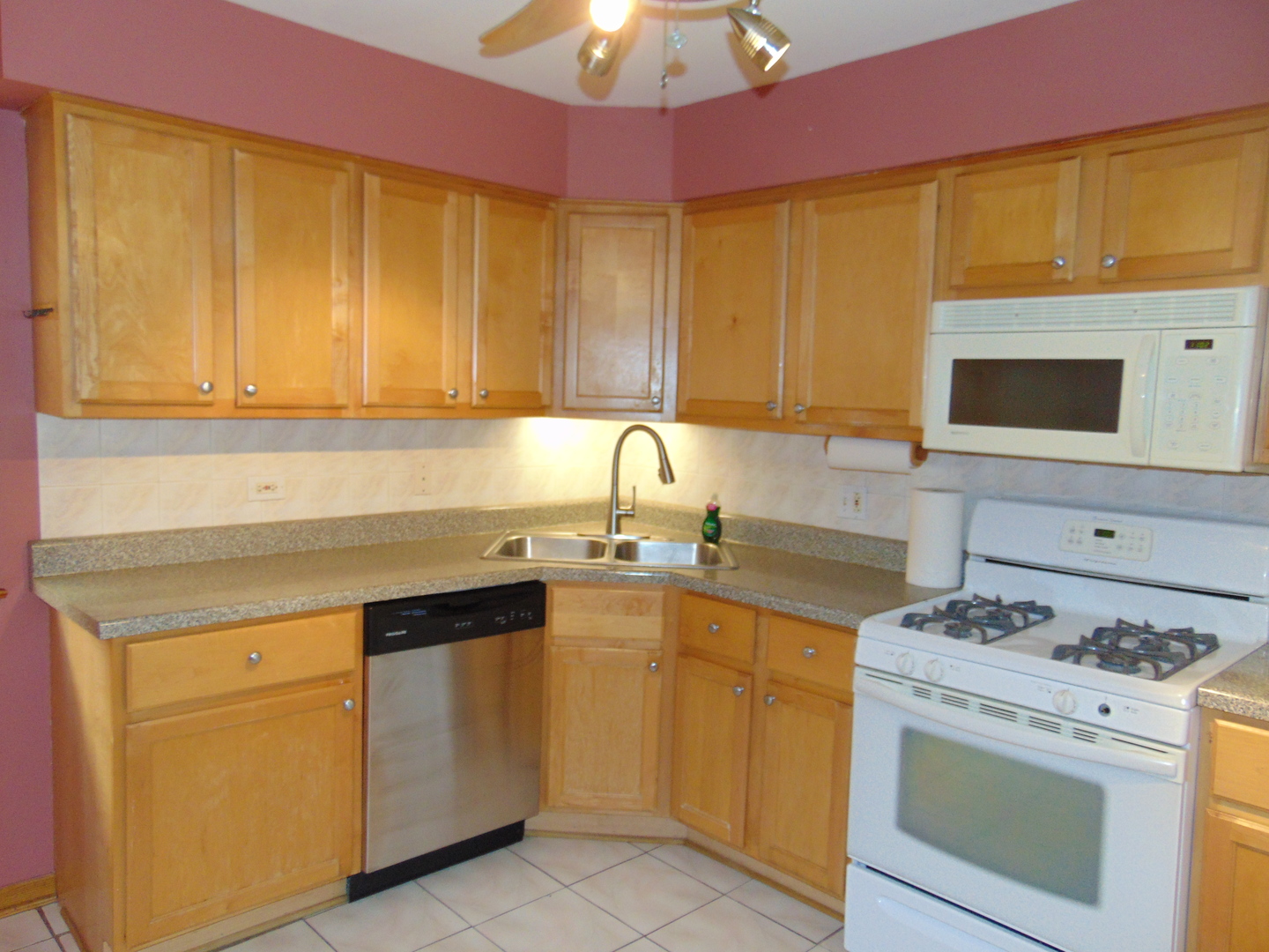 3804 North Harlem Avenue, Unit 4 Chicago, IL 60634 - Photo 3 of 15 a kitchen with a sink stove and cabinets