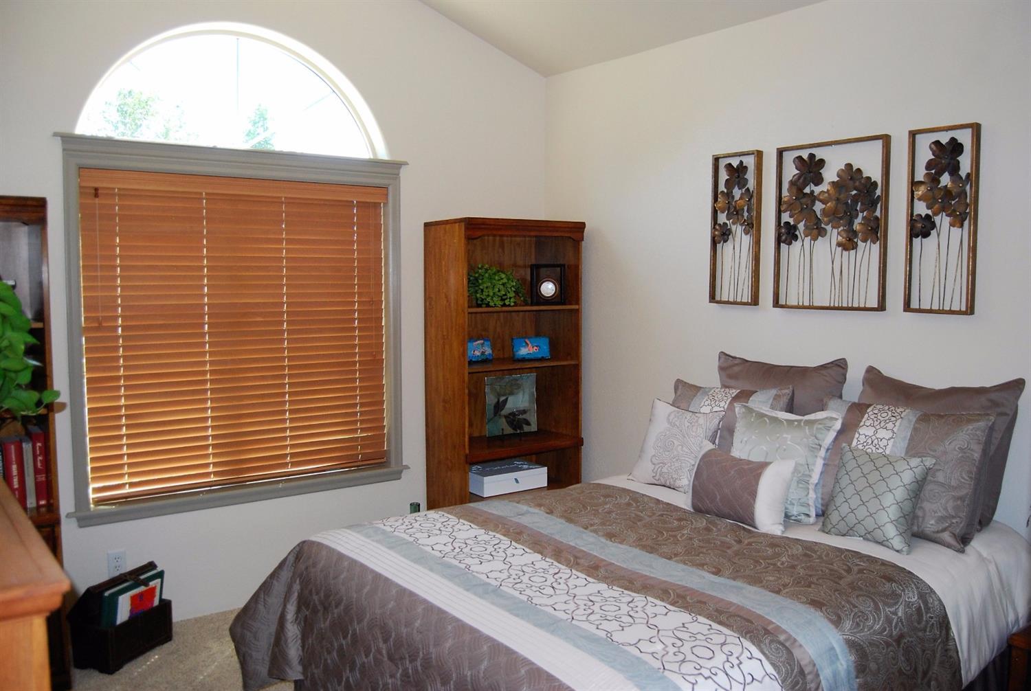 1136 Grouse Ridge Drive Central Point, OR 97502 - Photo 30 of 35 a bedroom with a bed and a window