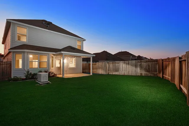 a view of a back yard of the house