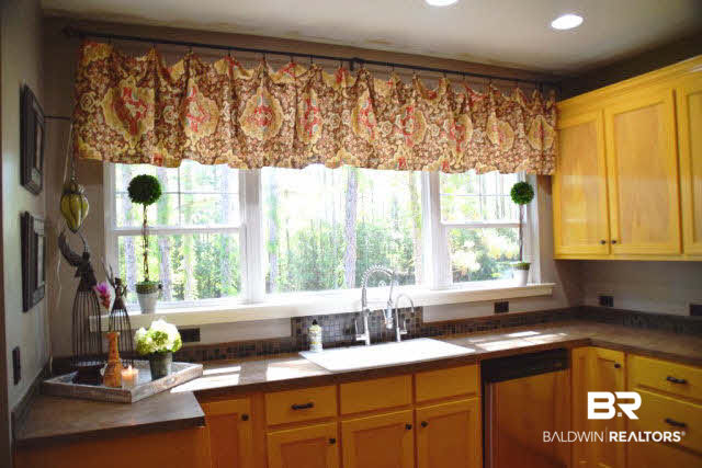 13848 Elmwood Court Stapleton, AL 36578 - Photo 3 of 27 This kitchen has miles of counter space and tons of cabinets. Open and spacious. Perfect for parties.