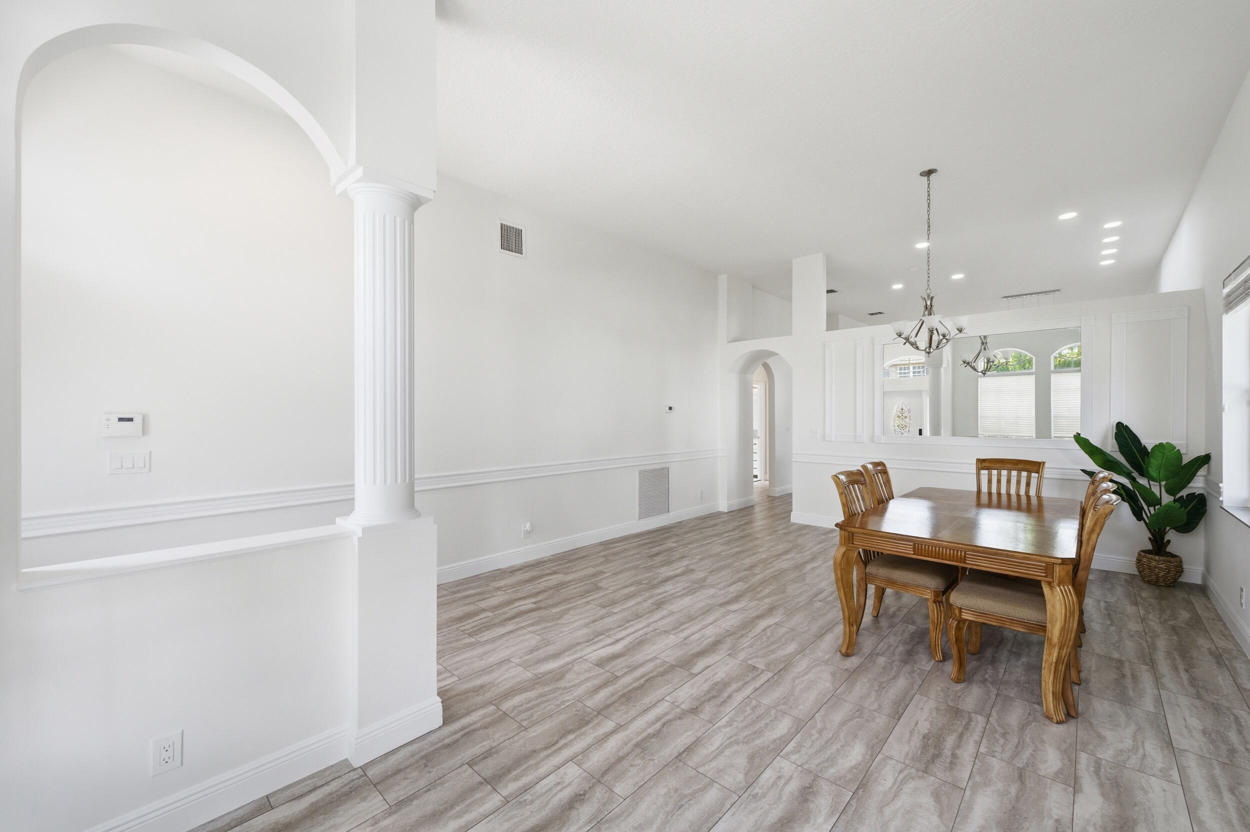 8534 Vía D Oro Boca Raton, FL 33433 - Photo 4 of 34 a living room with furniture and a wooden floor