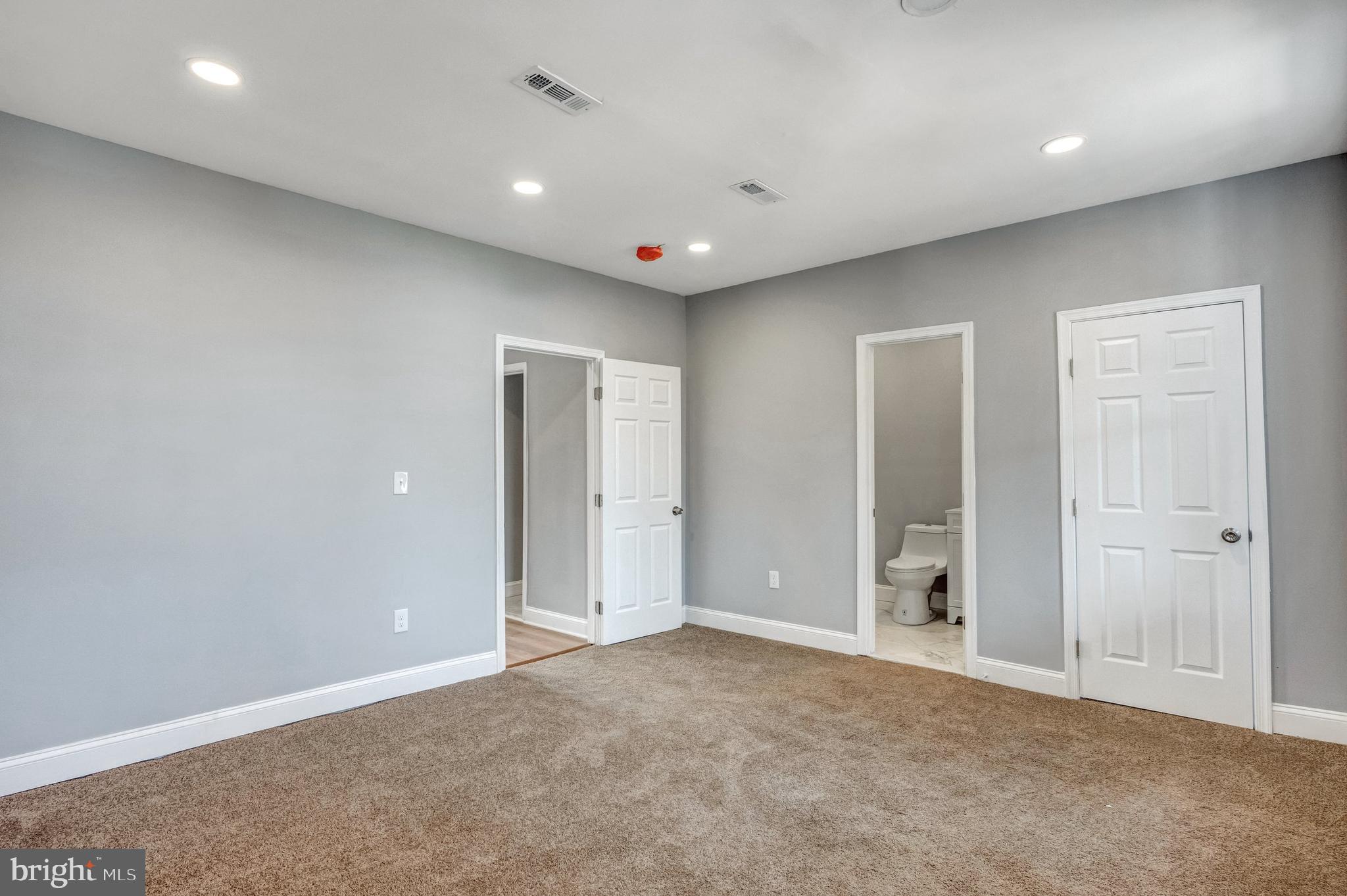3816 Bonner Road Baltimore, MD 21216 - Photo 21 of 36 an empty room with closet and a bathroom