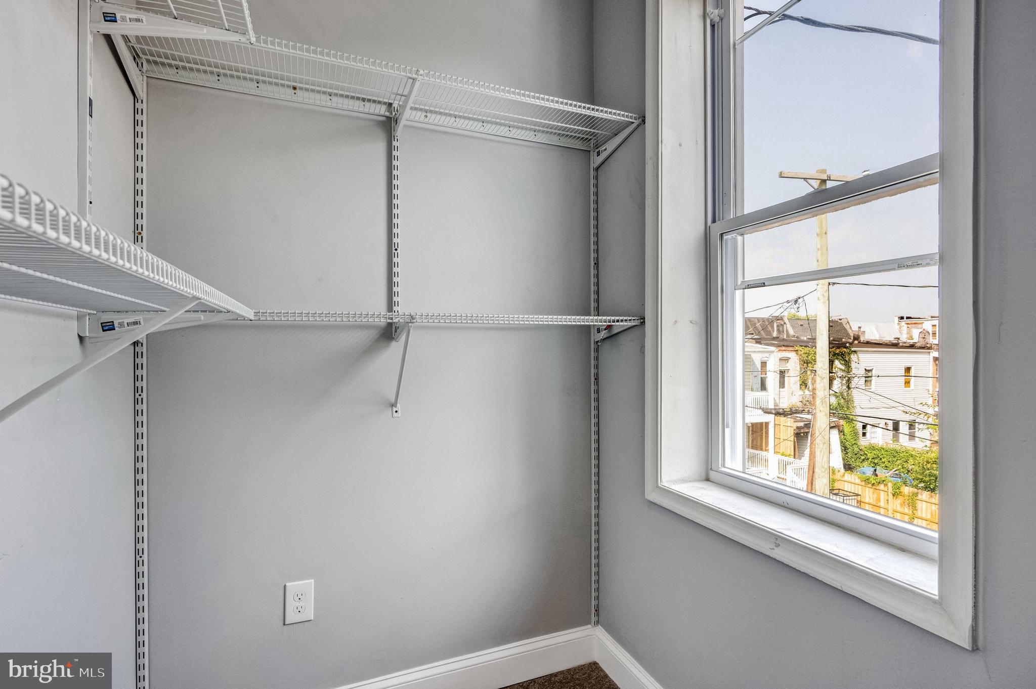 3816 Bonner Road Baltimore, MD 21216 - Photo 23 of 36 a view of a window in an empty room