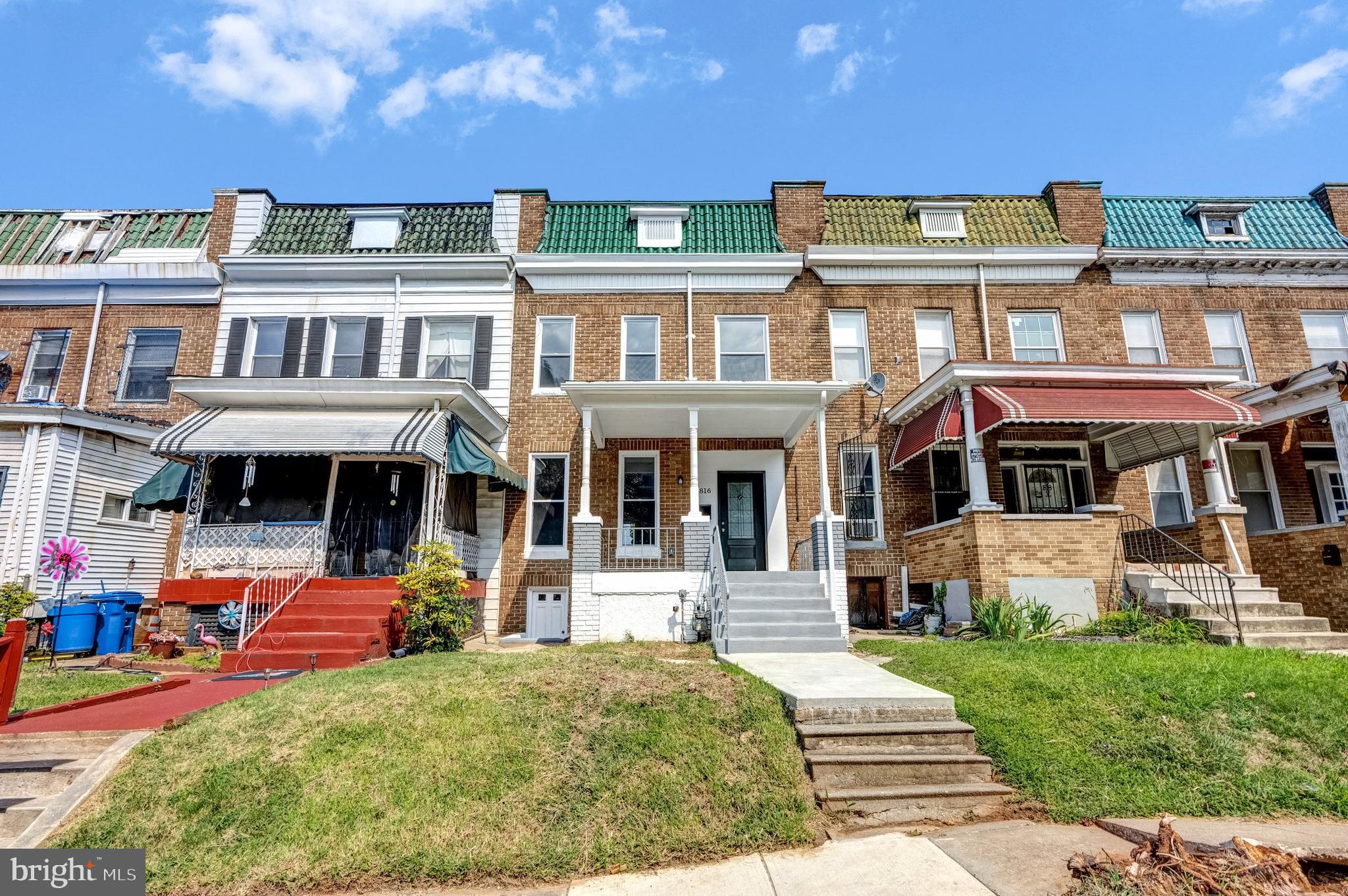 3816 Bonner Road Baltimore, MD 21216 - Photo 3 of 36 a front view of a residential apartment building with a yard