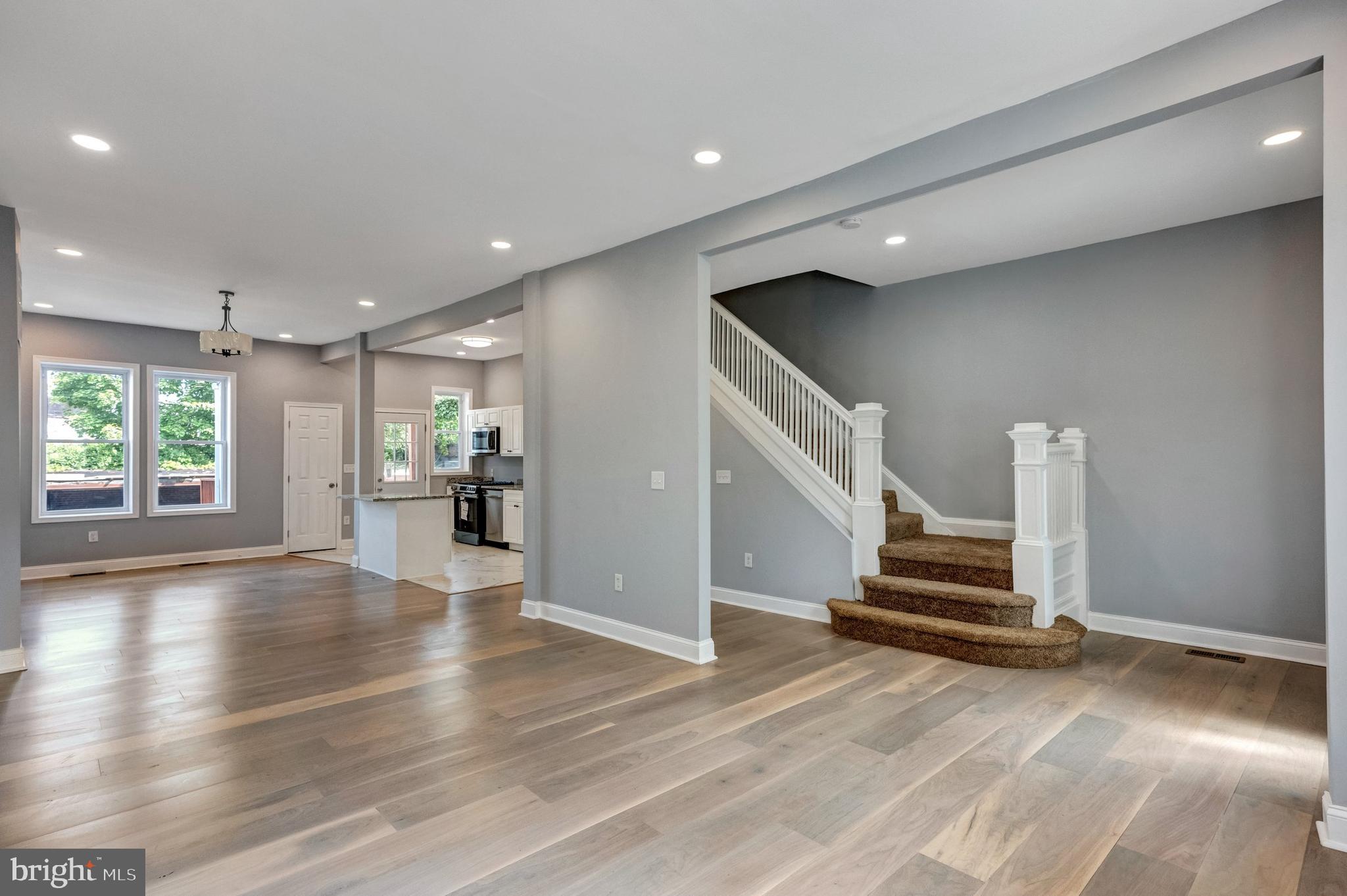 3816 Bonner Road Baltimore, MD 21216 - Photo 6 of 36 a view of an entryway with wooden floor and a kitchen