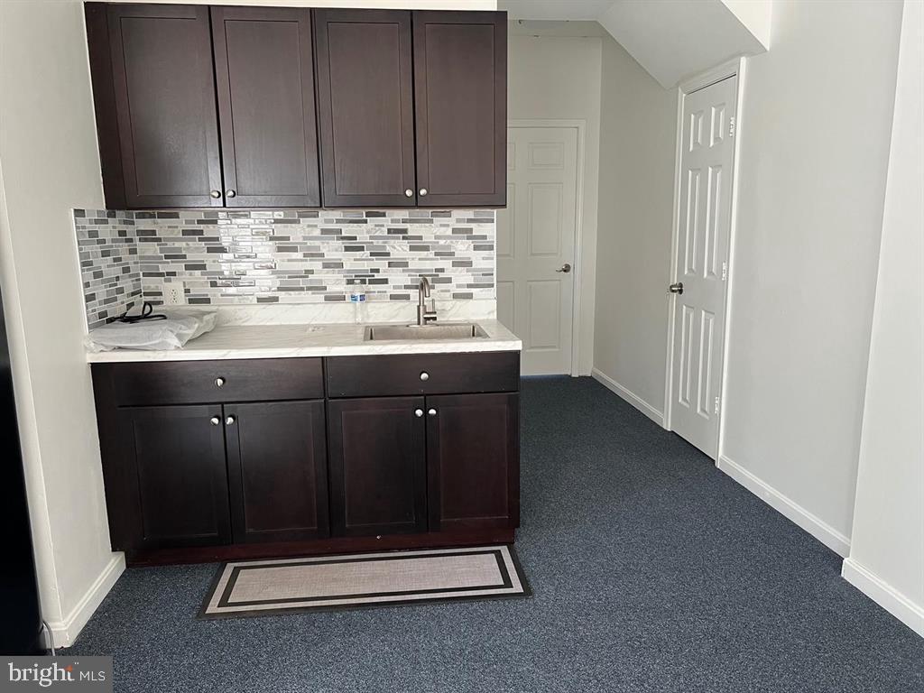 4244 La Mauricie Loop Dumfries, VA 22025 - Photo 11 of 16 a room with a sink and cabinets