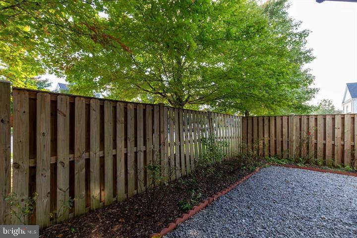 4244 La Mauricie Loop Dumfries, VA 22025 - Photo 16 of 16 a view of wooden fence in a backyard