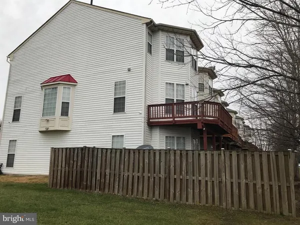 a view of house with a yard