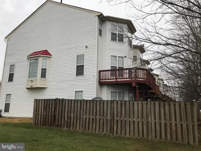 a view of house with a yard